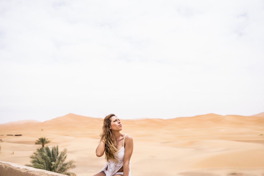 Woman on terrace against desert landscape