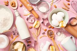 Raw ingredients for baking on the pink table