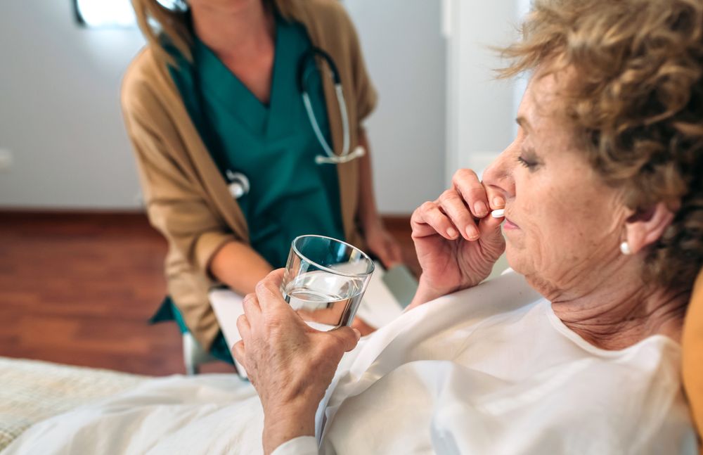 Mature patient taking a pill