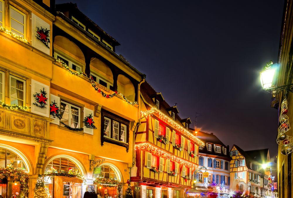 Calm street in Colmar, Alsace, France lit up for Christmas