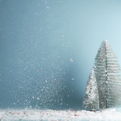 Winter, Christmas or  New Year background with fir trees and falling snow at blue