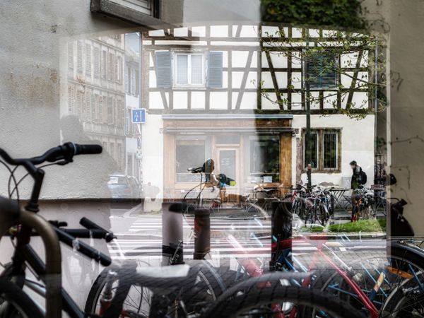 Multiple exposure. Unusual view of the city. Bicycles and old city of Strasbourg.