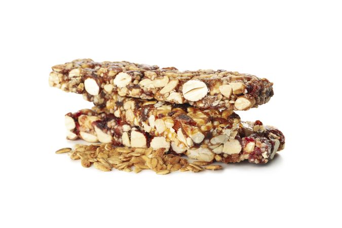 Tasty granola bars isolated on blank background