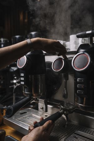 Barista using coffee machine