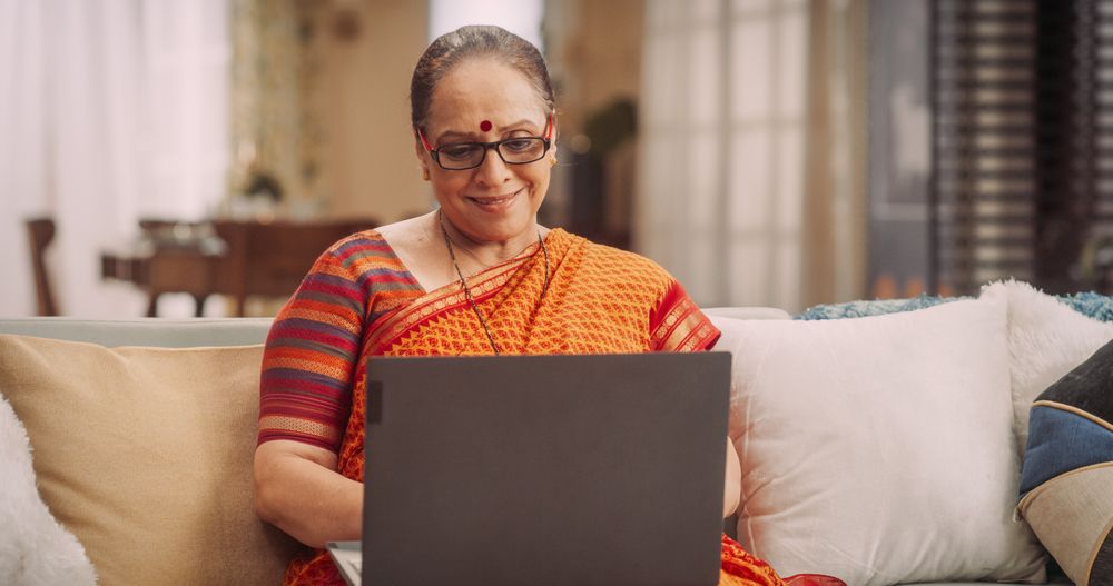 Older Indian Woman Using Laptop at Home