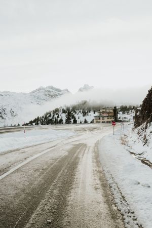 Countryside road between snow hills