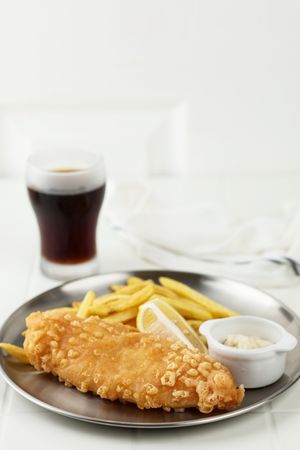 Fish and Chips is a Hot Dish of Fried Fish in Flour Batter, served with Chips or French Fries and Cola