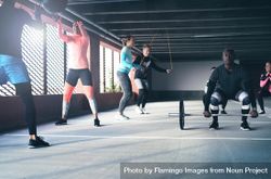 Group of diverse men and women doing circuit training 4ZBPO4