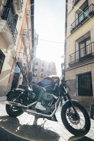 Young woman in custom motorbike