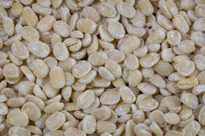 A background full of Split Gram also called Urad Dal