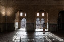 Girl enjoying the light of the Alhambra in Granada 4BaMqX