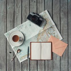 Open map on wooden background