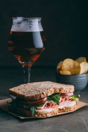 Delicious sandwich with ham, cheese, lettuce and tomato