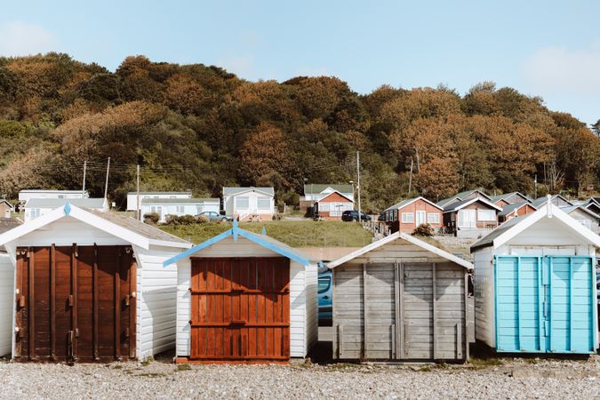 Small wooden houses by forest