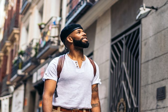 Stylish Black man walking on the city street