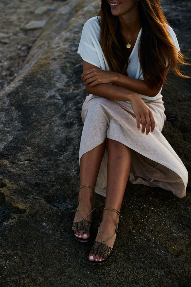 young woman posing on rock