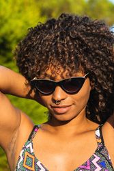 Trendy female on tropical street