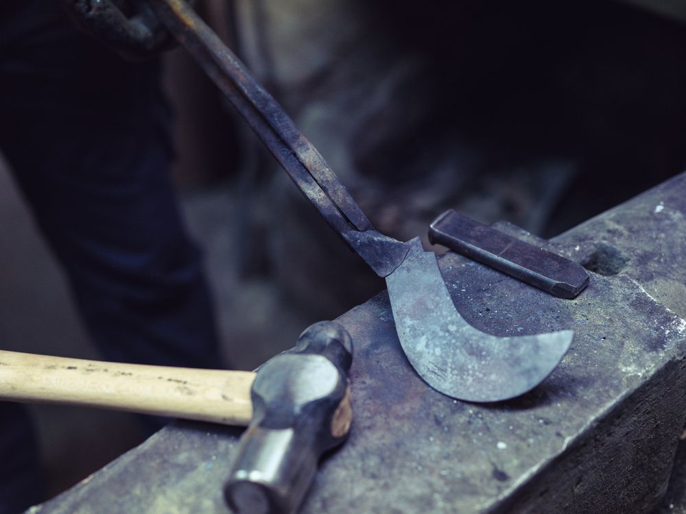 Crop blacksmith showing metal detail on anvil