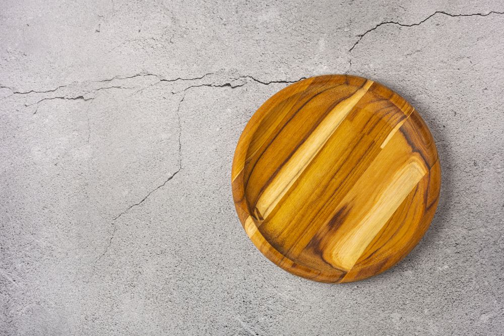 Empty plate on the slate table. Top view of the image.
