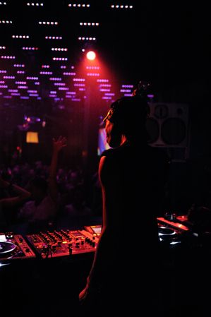Man DJing at night club