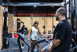 Hispanic sportspeople training in gym