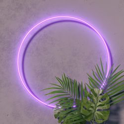 Fluorescent circle frame with tropical leaves