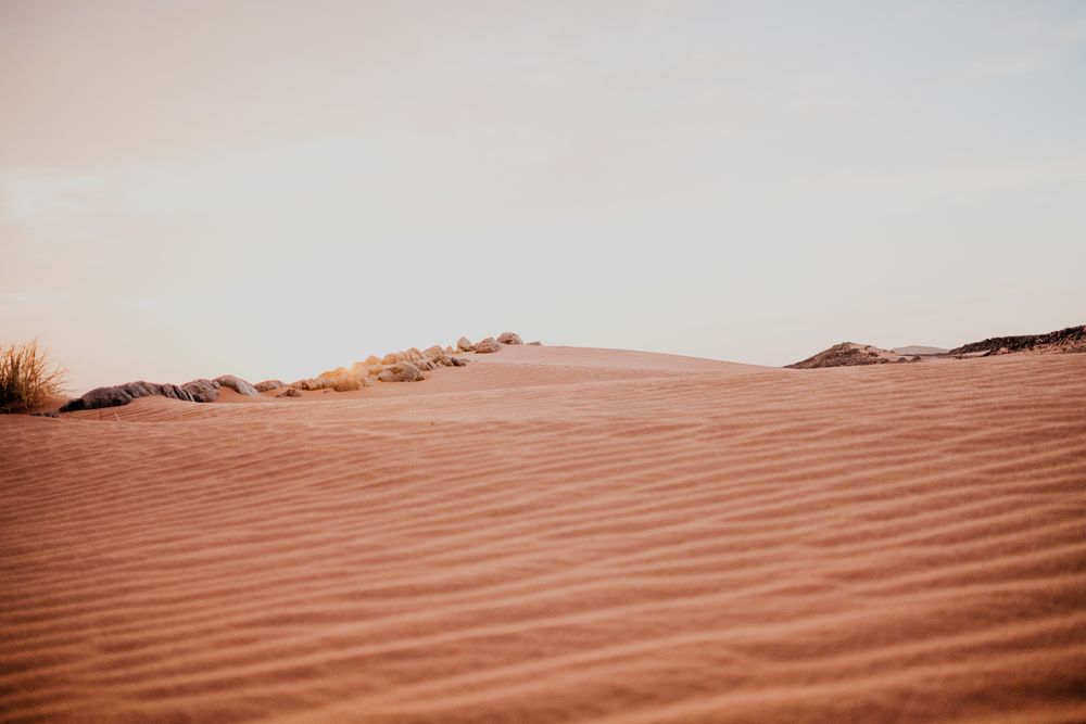 Sunset sky over hills in desert