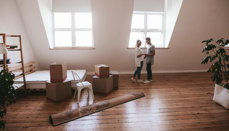 Romantic couple standing in new apartment