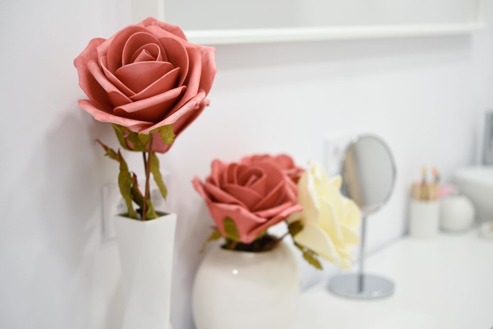 Close up of decorative flowers on shelf