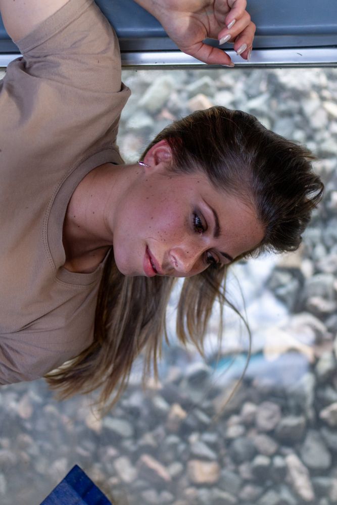 Military woman lying on window