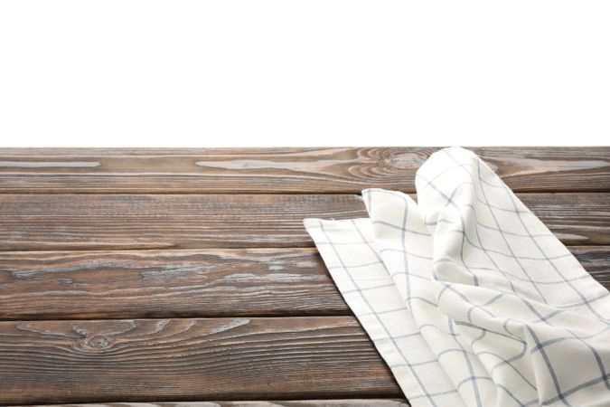 Fabric napkin on table against studio background, space for text