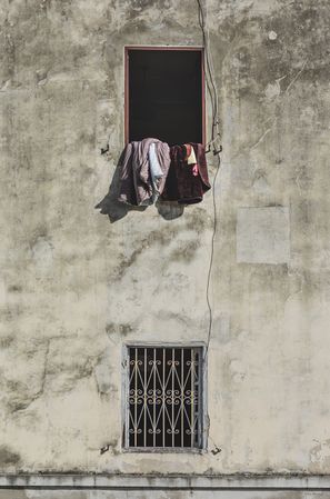 Cloths hanging and drying from window