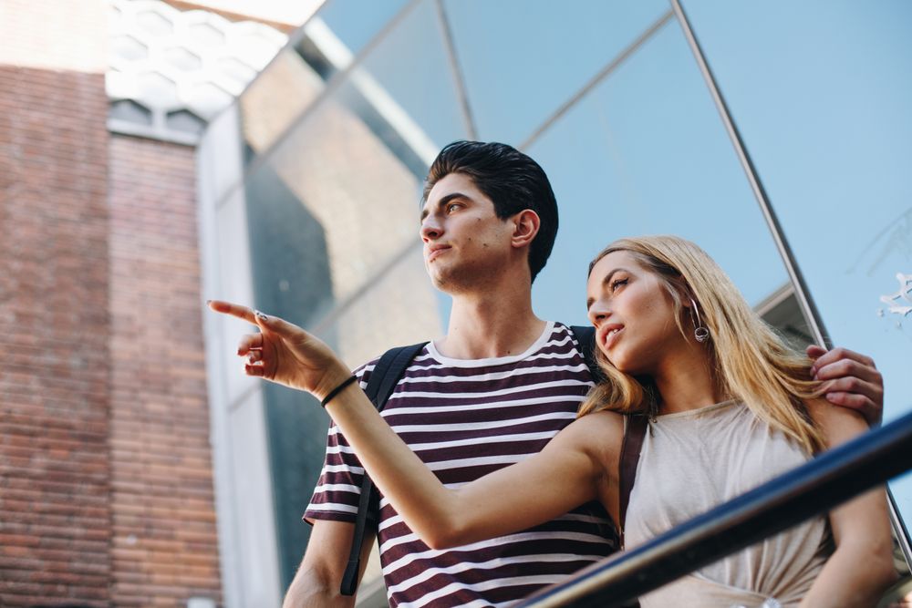 Young tourists couple standing outdoors