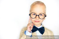 Inquisitive blond boy in glasses and bow tie 4OxYJb