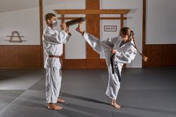 Female demonstrate Krav Maga punch in modern room