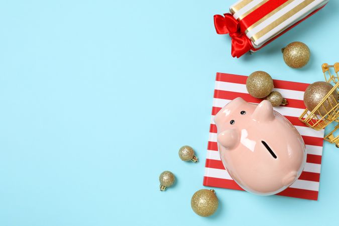 Concept of Christmas finance with piggy bank, space for text