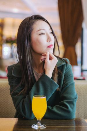 Asian woman sitting in cafe
