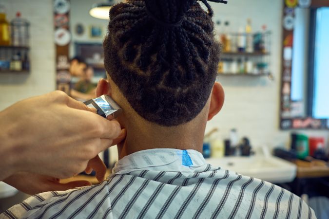Anonymous hairstylist doing a haircut