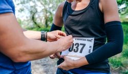 Woman placing the race number