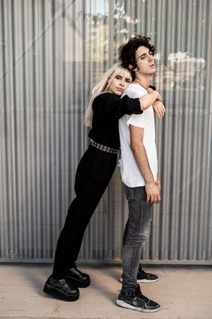 Couple near stripped modern building