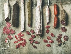 Variety of sliced Spanish or Italian cured meat sausages