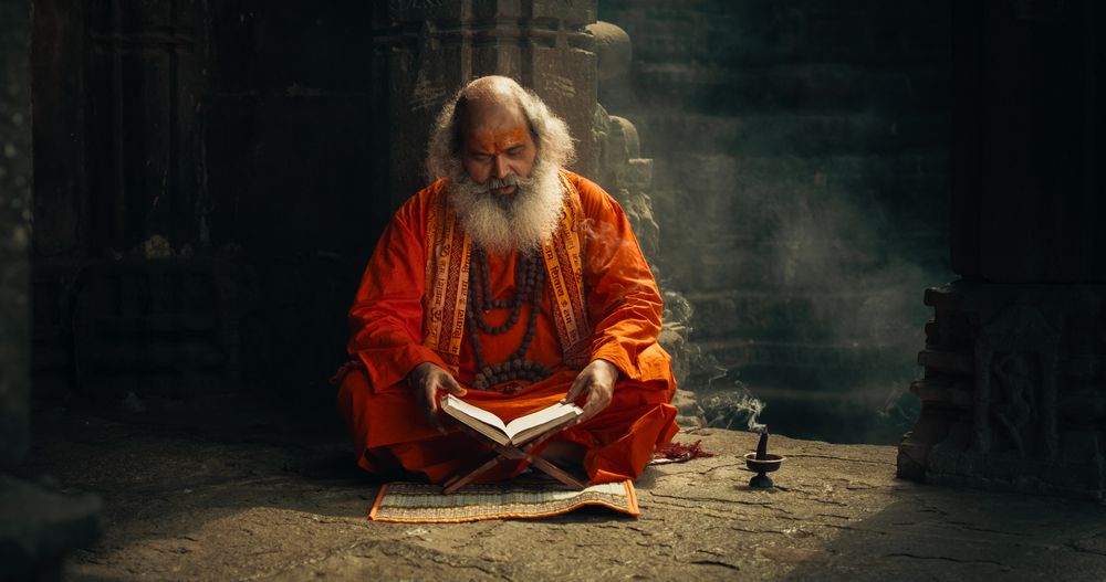 Portrait of a Hindu Monk Looking at the Camera and Smiling in an Ancient Temple.