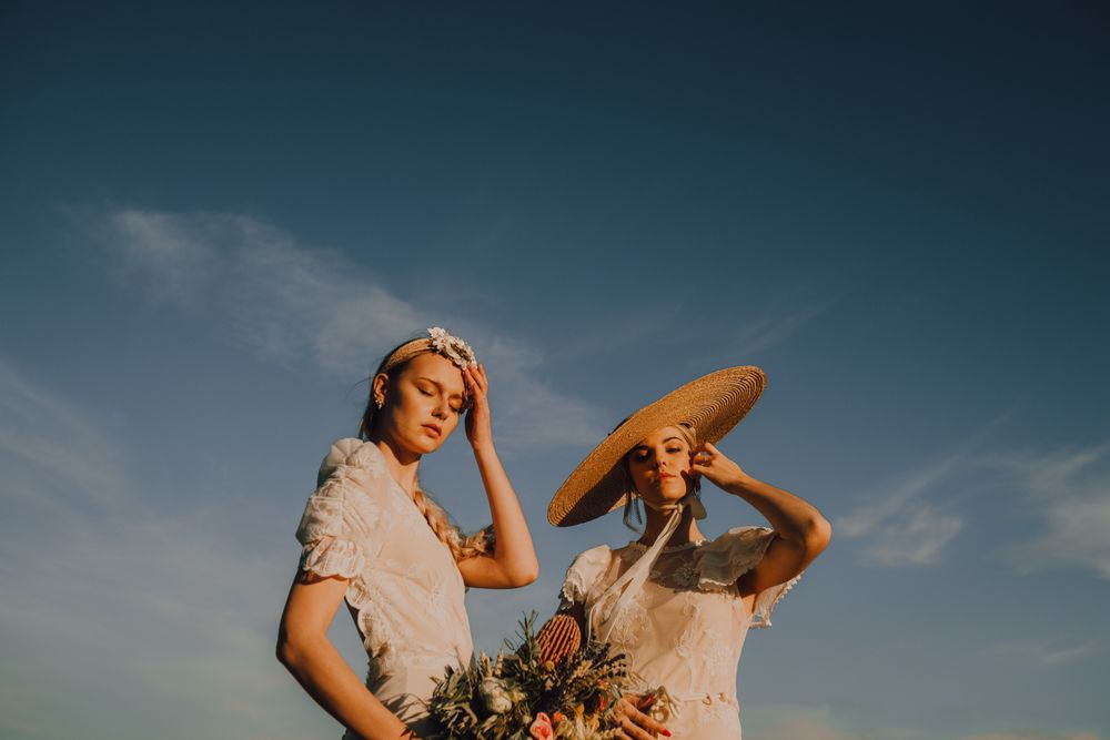women in hats in bright sunny day