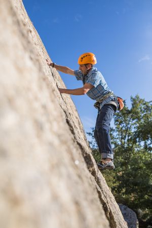 Free climber climbing in nature