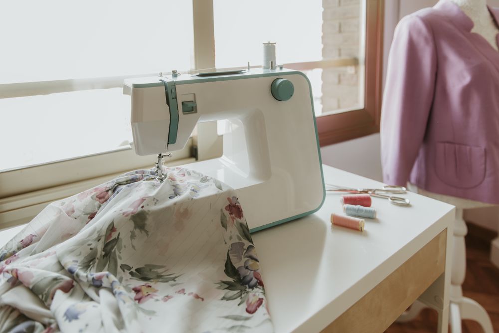 Dummy with blouse near sewing machine