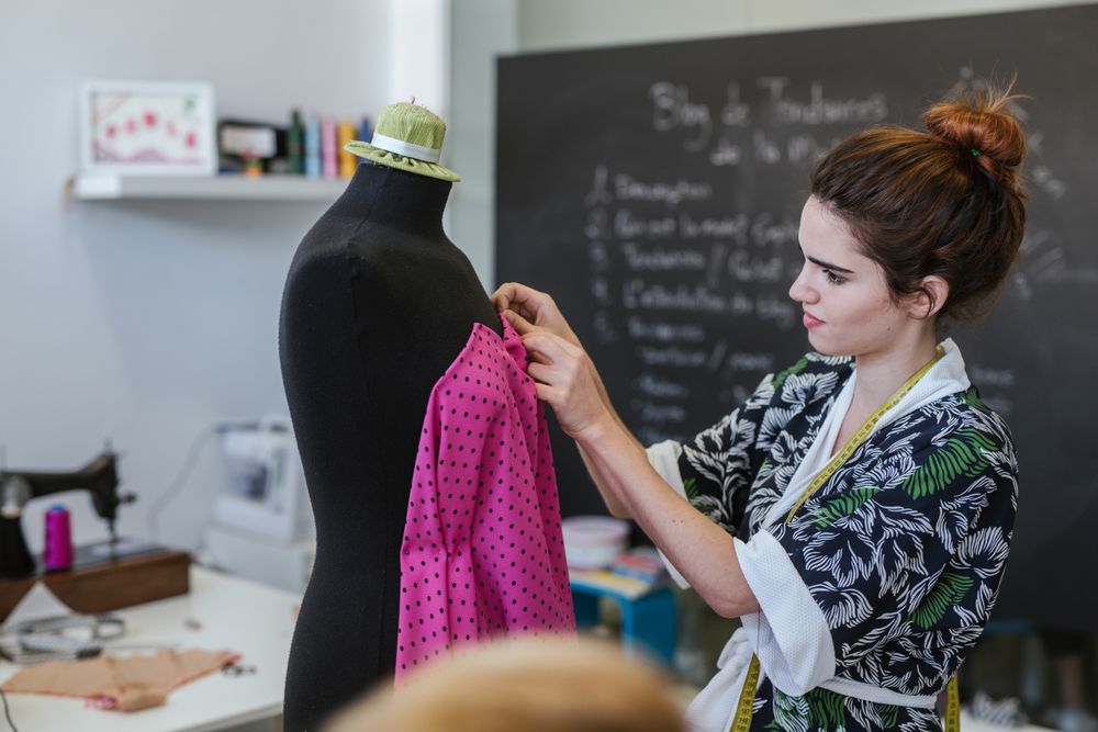 Woman in a sewing school