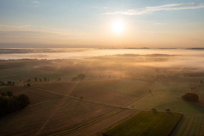 Aerial scenery at golden hour with a foggy morning in rural Germany