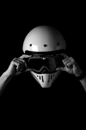 Rider in helmet and glasses at studio