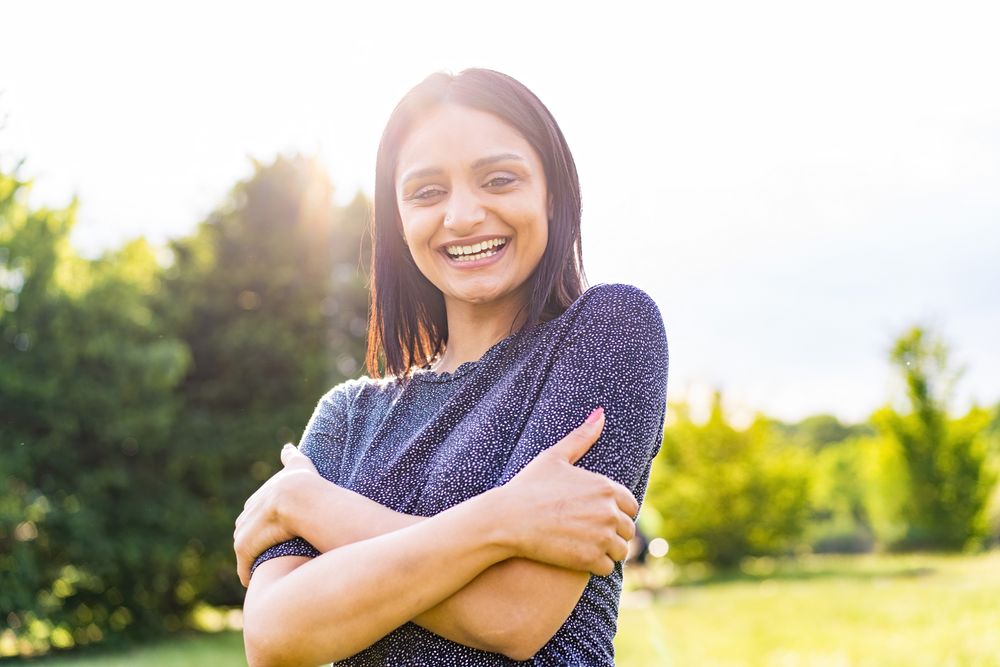Radiant Indian woman in sunny park
