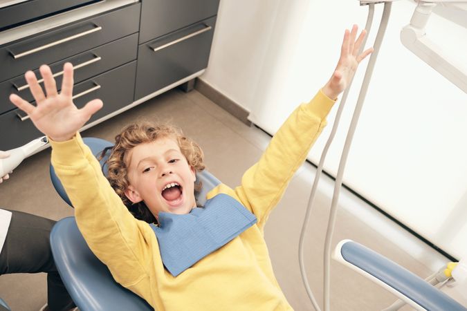 Excited boy on dental chair